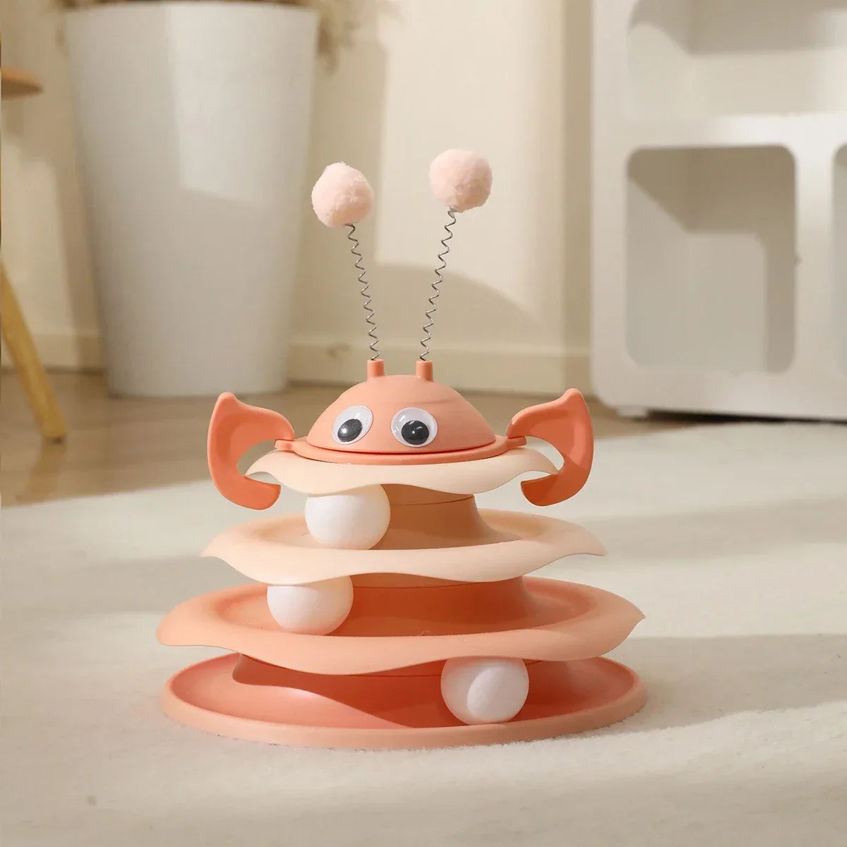 Toy with a layered design and springy elements on a light surface