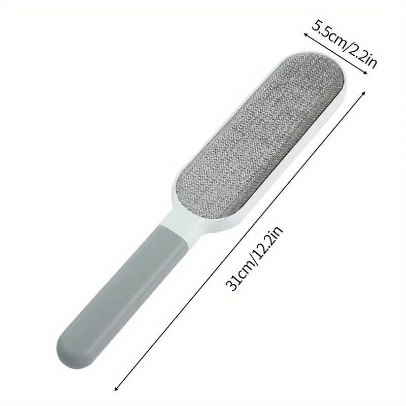 Gray pet grooming brush with measurements on a white background
