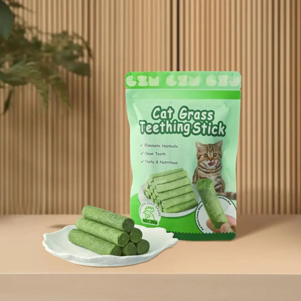 Cat Grass Teething Stick packaging with green sticks on a white plate against a wooden background