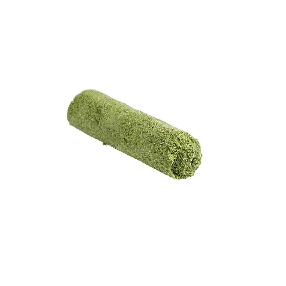 Rolled-up green towel on a white background