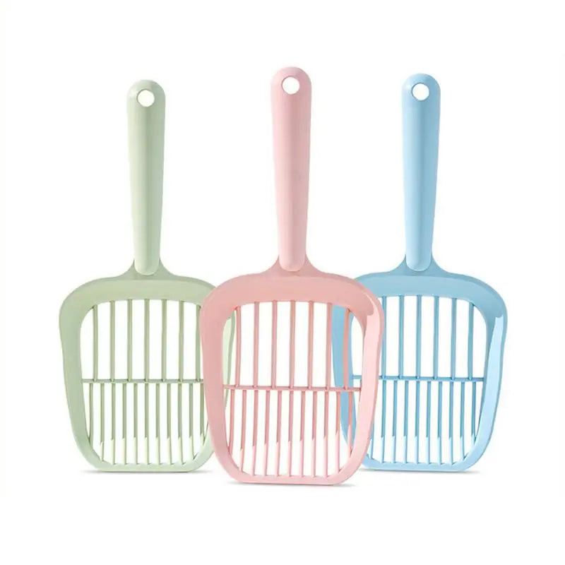 Three colorful pet grooming tools with handles on a white background