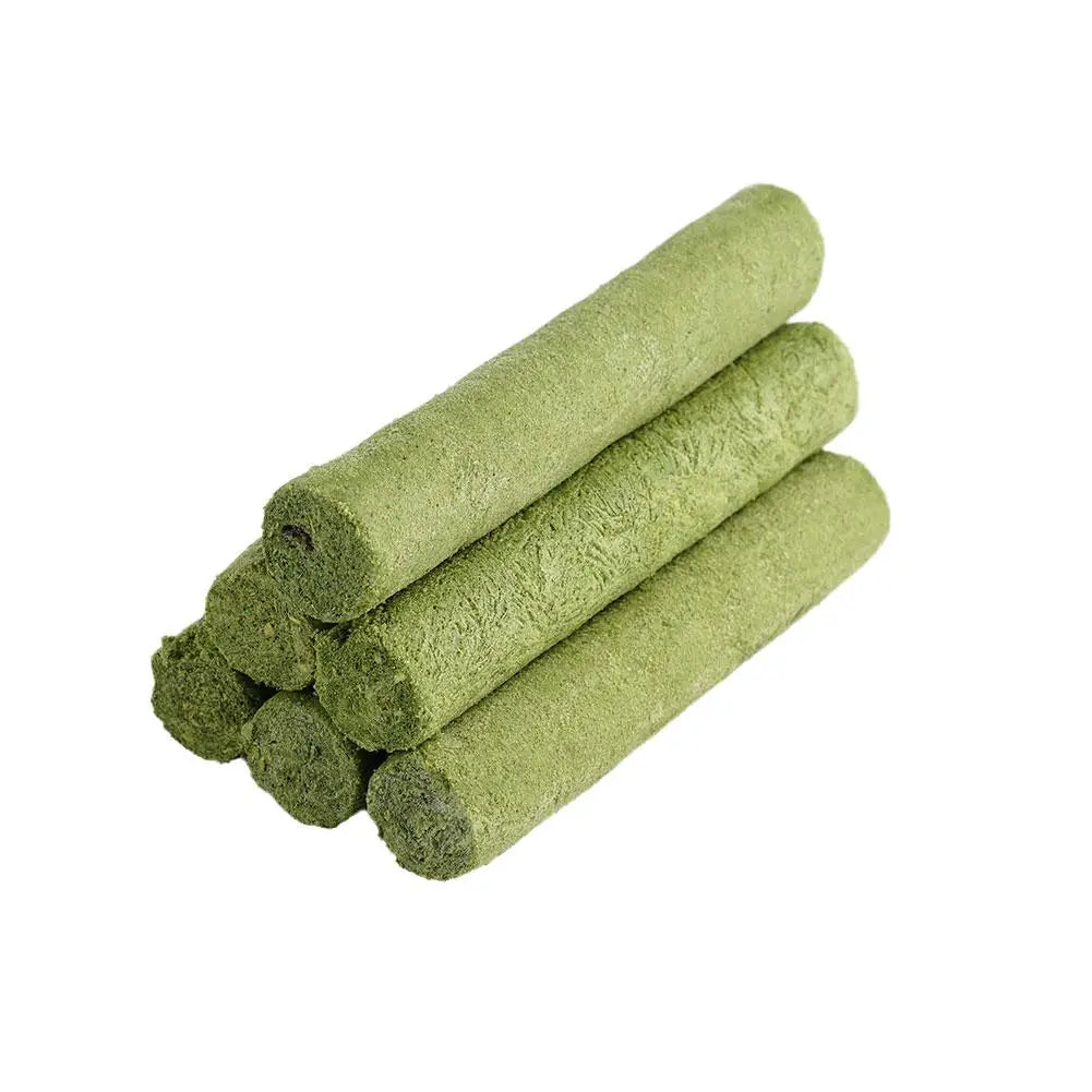 Stack of green rolled-up towels on a white background